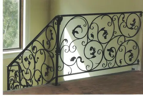 Interior railing panel with scrollwork and pierced leaf details