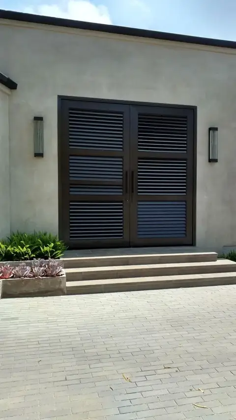 Modern louvered iron double entry doors