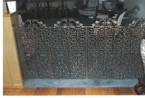 Folding fireplace screen with dense filigree panels