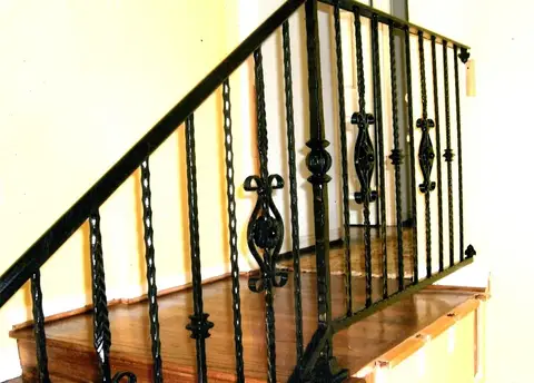 Stair railing with twisted bars and ornate basket balusters