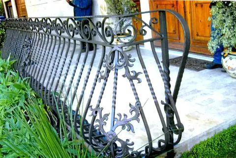 Walkway railing with twisted bars and fleur-de-lis scrollwork
