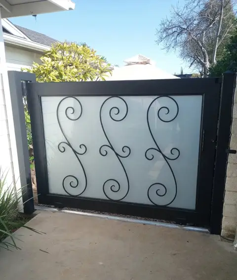 Modern side gate with a frosted panel and an S-scroll design